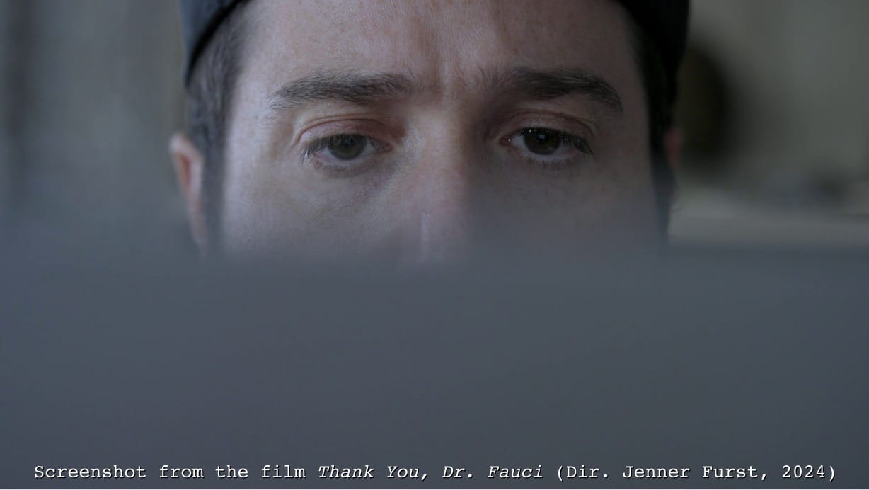 Screenshot from Thank You Dr. Fauci: Director Jenner Furst stares at his laptop screen. 25% of the movie consists of Zoom calls.